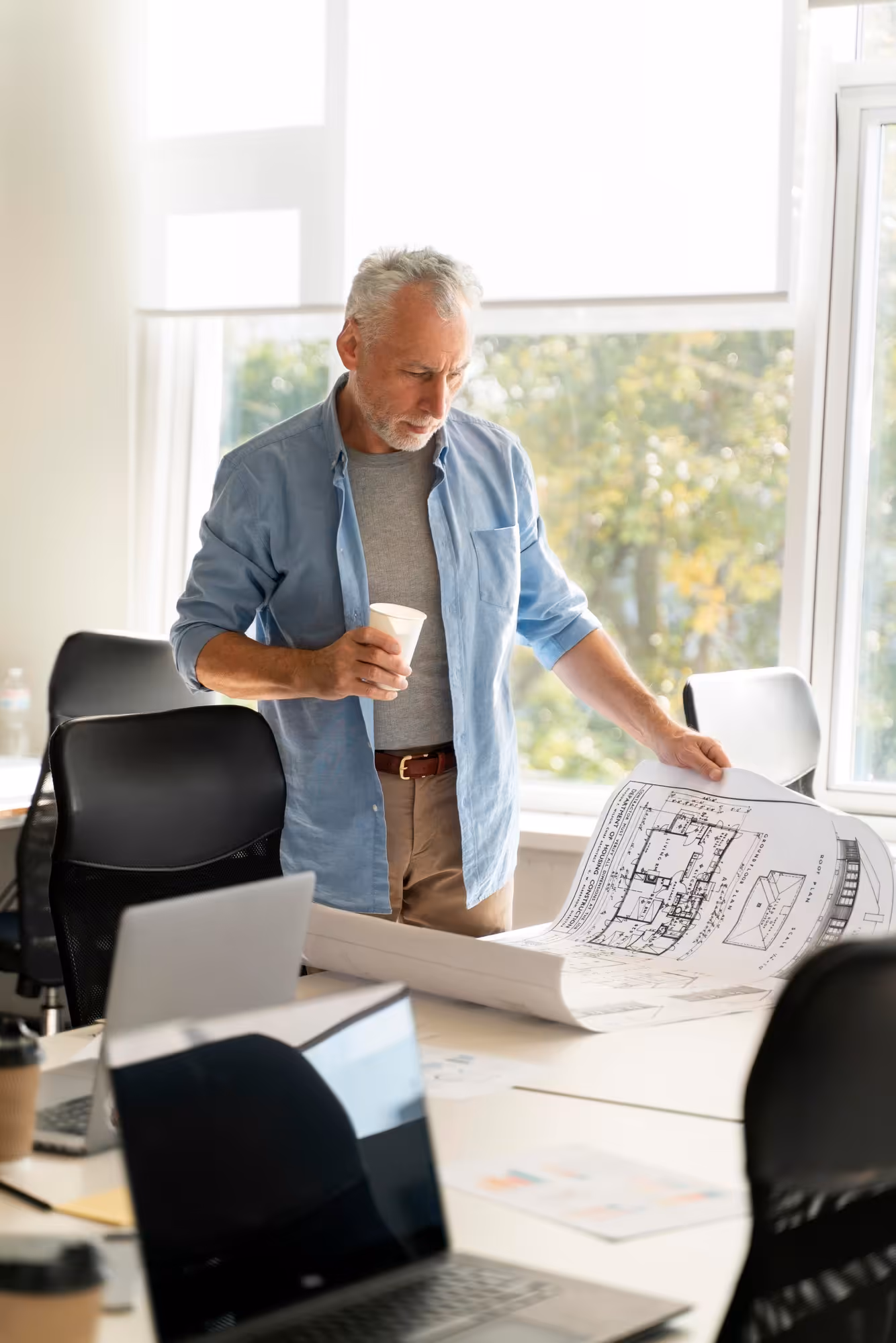 A web designer working at a laptop